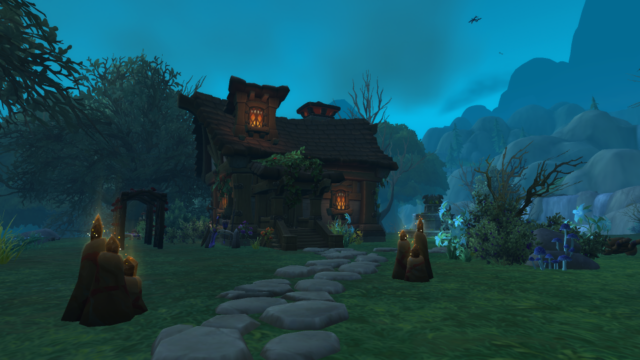 A house in the Alliance Neighborhod Founder's Point. It's in a spooky forest, a flagstone path leading to the front door.